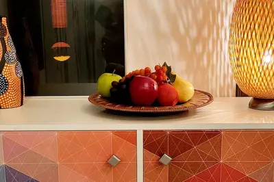 a plate of fruit sitting on a counter at Welcome to Happy Place where Cozy Comfort Meets Exquisite Luxury in Edmonton