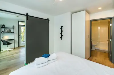 a bedroom with a bed with two towels on it at NN War Eagles Nest Ravens Ridge 1bed 1 bath in Whitehorse