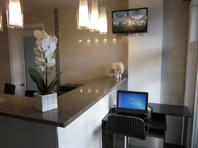 a laptop computer sitting on a counter in a room at Rest Inn in Terrace
