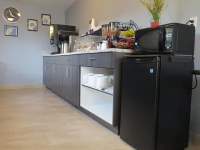 a kitchen with a black refrigerator and a counter top at Rest Inn in Terrace