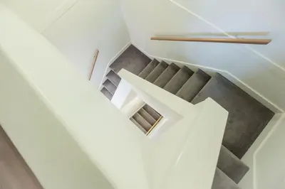 a staircase in a house with a letter x at Lake Placid Lodge by Outpost Whistler in Whistler