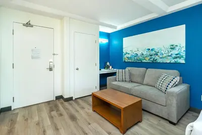 a living room with a couch and a table at Quality Inn & Suites in Clearwater