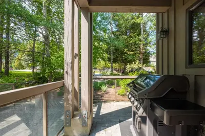 a screened in porch with a view of a pool at Greyhawk 123 by Outpost Whistler in Whistler