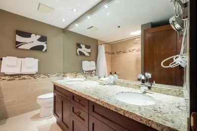a bathroom with a sink and a toilet at Greyhawk 123 by Outpost Whistler in Whistler