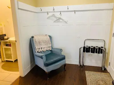 a blue chair with a blanket on a wall at Evergreen Bed & Breakfast in Hope
