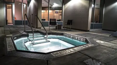 a jacuzzi tub in the middle of a building at Grey Eagle Resort in Calgary