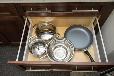 a bunch of pots and pans in a drawer at The Jade Place in Airdrie