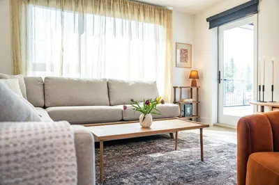 a living room with a couch and a coffee table at Sea Eagles Landing by Revelstoke Vacations in Revelstoke