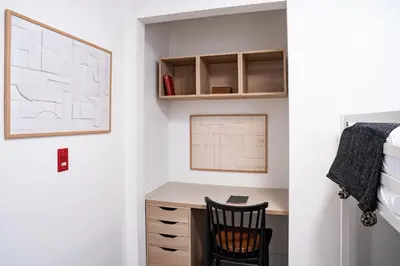a bedroom with a desk and a chair at Sea Eagles Landing by Revelstoke Vacations in Revelstoke