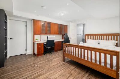 a bedroom with a bed and a desk at Gorgeous 4 Bedroom Garden Level Suite at Vancouver West & UBC in Vancouver