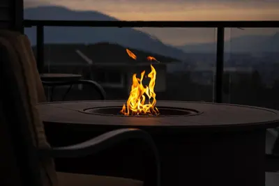 a fire pit sitting on top of a table at Mountain Retreat with Views, Hot Tub, Games & AC in Chilliwack