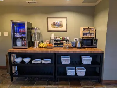 a counter with bowls and a blender on it at Copper Horse Lodge in Golden