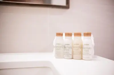 two bottles of lotion sitting on a counter in a bathroom at Arrowhead Point by Outpost Whistler in Whistler