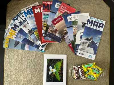 a bunch of magazines on a table with a picture at Coze home in Vancouver near YVR in Vancouver