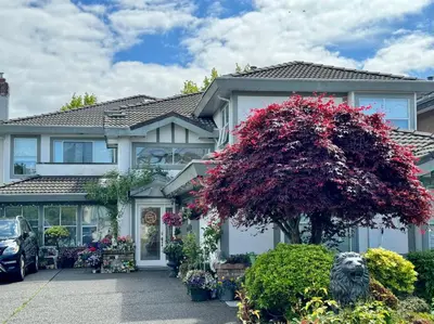 a house with a red tree in front of it at sweet home in Richmond