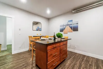 a kitchen with a island in the middle of a room at Heaven's Haven in Vernon
