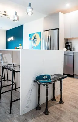 a kitchen with a table in the middle of it at The Ski Shanty by Revelstoke Vacations in Revelstoke