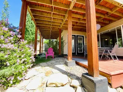 a wooden pergola on a house with a patio at Private, Spacious, & Bright Home in Calgary