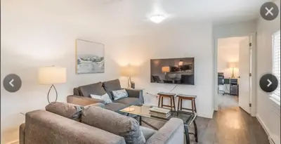 a living room with a couch and a table at Cosy country mobile home on 18 acres farm sleeps 5 in Port Alberni