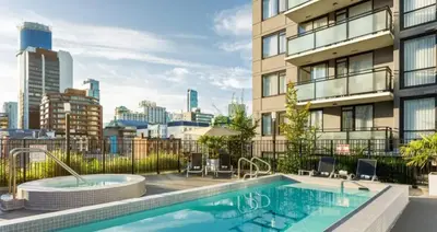 a swimming pool on top of a building at Level Vancouver Yaletown Seymour in Vancouver