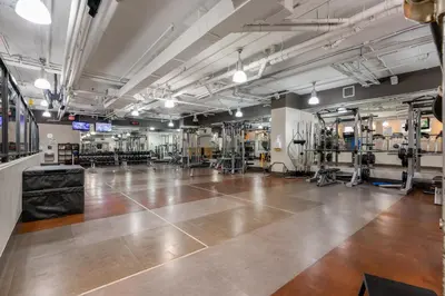 a large room with a wooden floor in a gym at Level Vancouver Yaletown Seymour in Vancouver