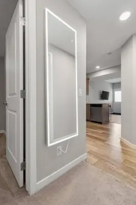 an empty room with a large mirror on the wall at Modern Basement Gem: 2 BR Retreat in Calgary