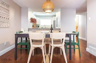a dining room with a table and chairs at Cozy 3BD w/AC, Patio, Theatre Room, 15 min to DT in Edmonton