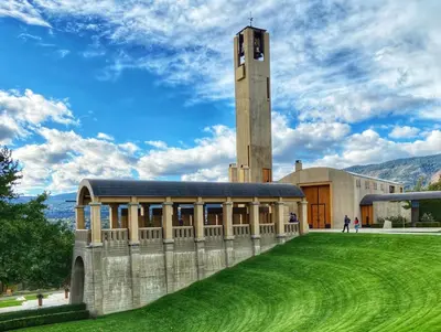 a building with a clock tower on top of it at Tranquil Retreat Spacious 2-Bedroom on the 2nd Floor in Kelowna