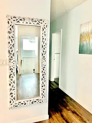 a large mirror on a wall in a room at Kelowna little Island near Downtown, lake, hospital and Okanagan Collage in Kelowna
