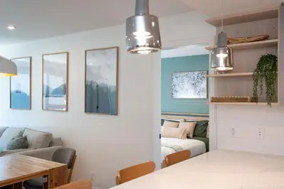 a living room with a couch and a table at Stoked On Revy - Family Condo in Revelstoke in Revelstoke