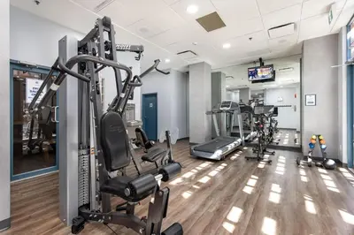 a gym with treadmills and cardio equipment in a building at Bright Whistler Village Getaway w/ pool & hot tub in Whistler