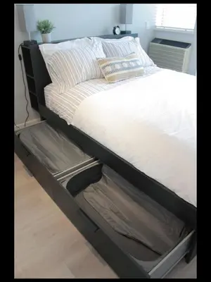 a bed frame with an empty box under it at Bright Whistler Village Getaway w/ pool & hot tub in Whistler
