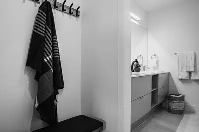 a bathroom with a sink and a towel hanging on a wall at Ghost Peak by Revelstoke Vacations in Revelstoke