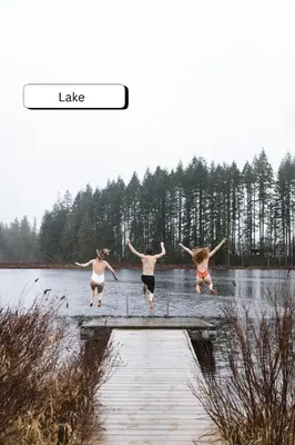 three people jumping off a dock into a lake at Smith Lake Farm in Merville