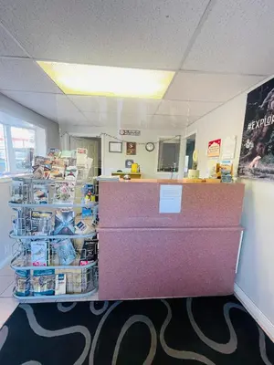 an office with a counter and a cash register at Fraser Bridge Inn in Quesnel
