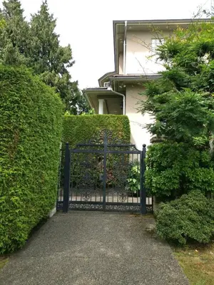 a black iron gate in front of a building at Van Nest near YVR UBC Downtown in Vancouver