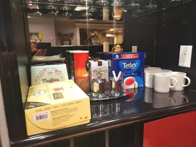 a counter with a table with cups and a box at Van Nest near YVR UBC Downtown in Vancouver
