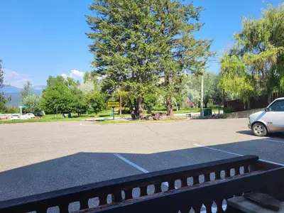 a white car parked in a parking lot at Alpen Motel in Radium Hot Springs