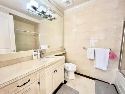 a bathroom with a sink and a toilet at Vancouver Airport guesthouse in Vancouver