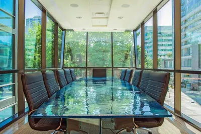 a conference room with a glass table and chairs at Hotel BLU in Vancouver