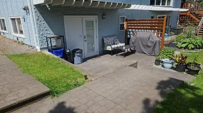 a patio in front of a house at Lovely 1 Bedroom Suite Near Town in Victoria
