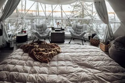 a large bed in a room with a large window at Refuge Bay's Ignis Dome - Luxury Off Grid Escape in Cherhill