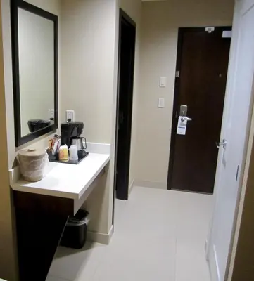 a bathroom with a sink and a mirror at Holiday Inn Express Golden-Kicking Horse by IHG in Golden