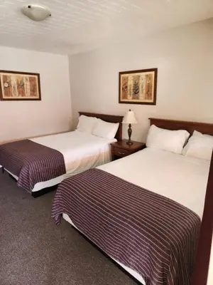 a hotel room with two beds in a room at Grantview Inn in Surrey