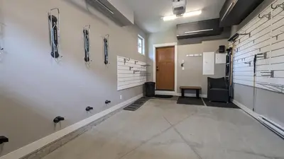 a large room with a hallway with a door and a room with a practition practition at Echo Landing #37 condo in Sun Peaks