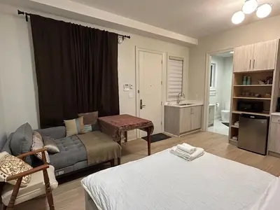 a small living room with a couch at Rose Garden Vacation Studio in Richmond
