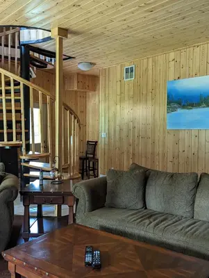 a living room with a couch and a table at Sundance Country Lodge B&B in Marlboro