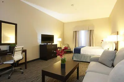 a hotel room with a bed and a desk at Holiday Inn Express Fort St John by IHG in Fort Saint John