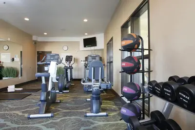 a fitness room with treadmills and exercise equipment at Holiday Inn Express Fort St John by IHG in Fort Saint John