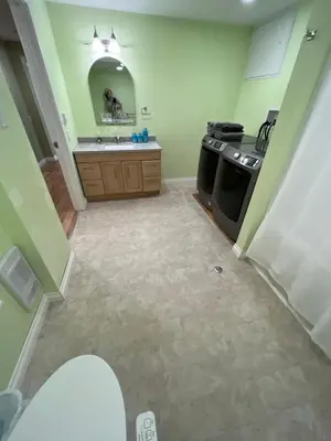 a kitchen with a sink and a stove at Bluejay Suites B&B in Whitehorse